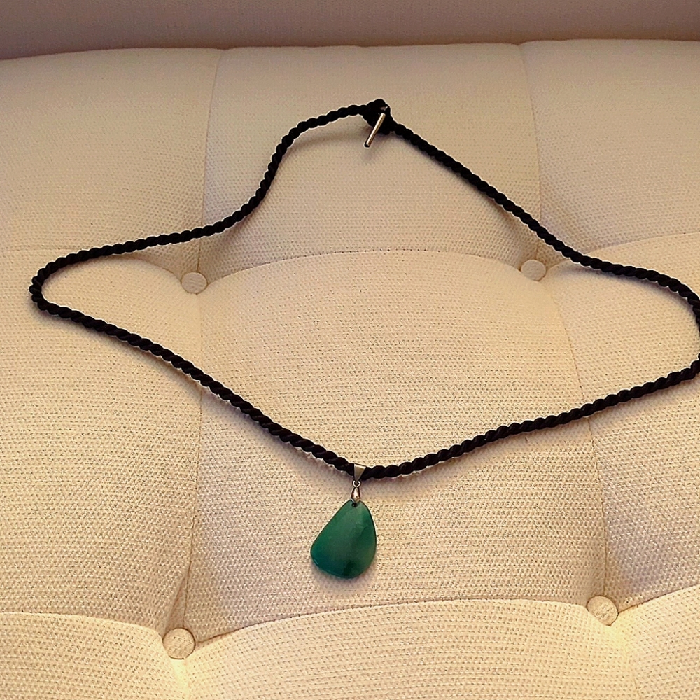 Silk chorded jade pendant